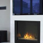 Aura Direct Vent By FMI / Design Dynamics offers a clean face, low profile fireplace  with glass pebbles and porcelain reflective panels; Available in  36” Natural or LP; 42” for Natural Gas only